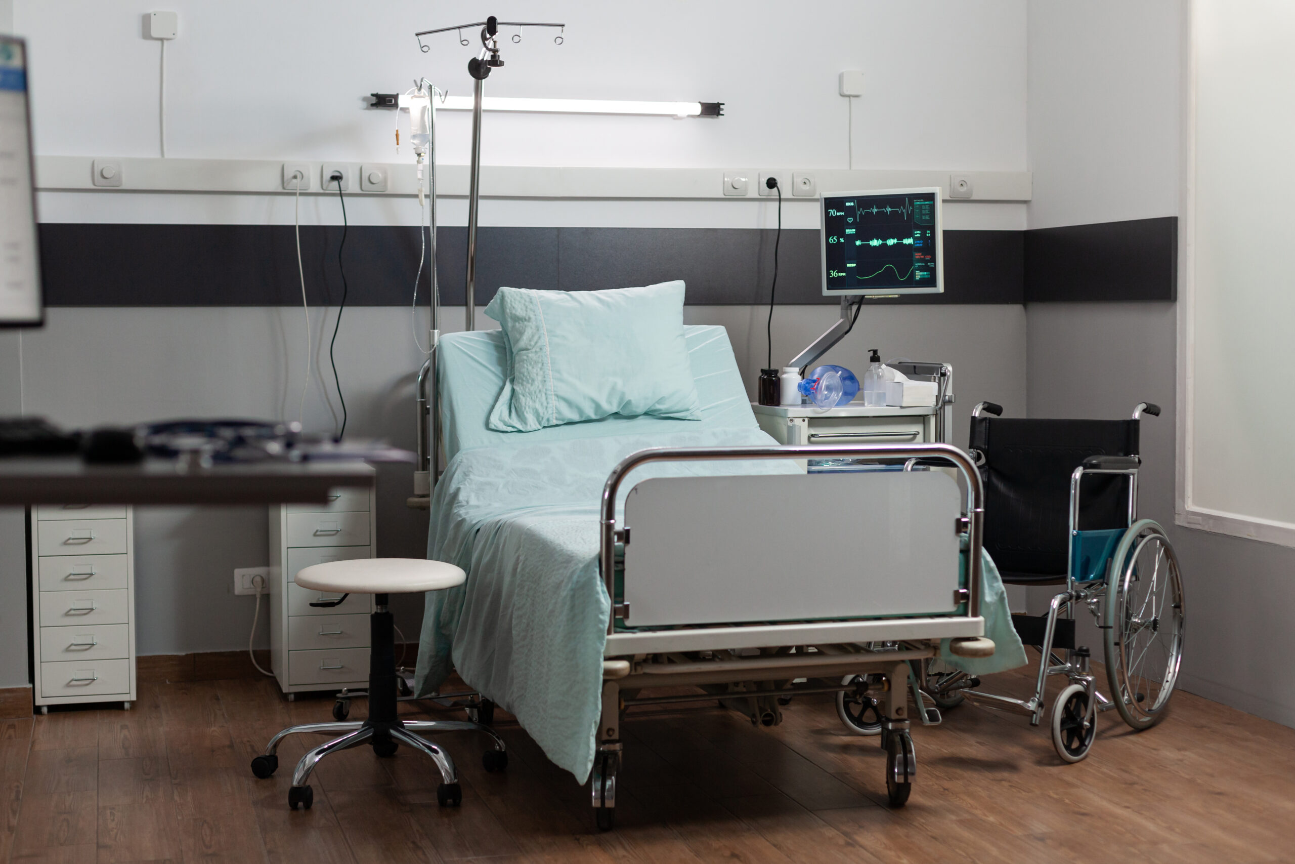 Empty hospital room with nobody in it having a single bed comfortable bed, modern equipment. Recovery room of hospital ward, sterile floor. Ambulatory room after surgery.